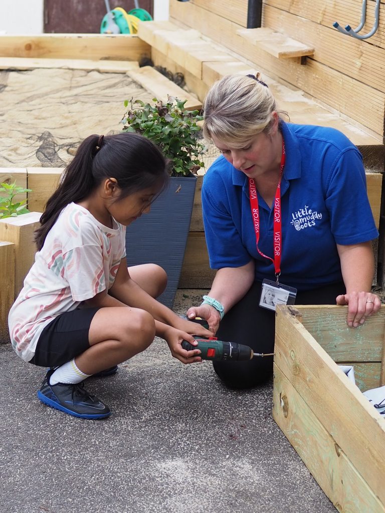 drilling new planters in winkfield primary school donated garden