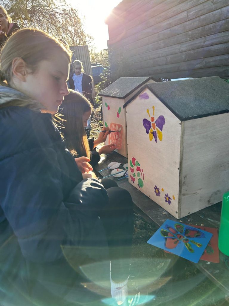 Children painting seed libraries